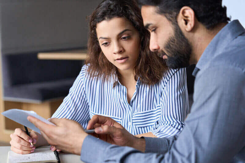 A male mentor mentoring a female client